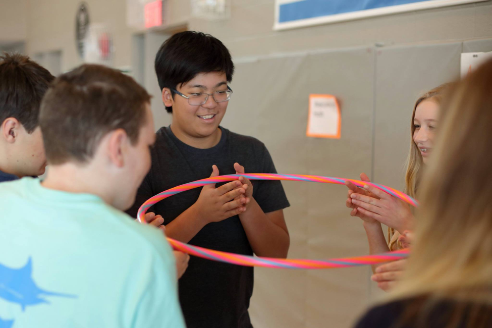 Grade 11 students practicing teamwork, negotiation, and leadership exercises at LCS